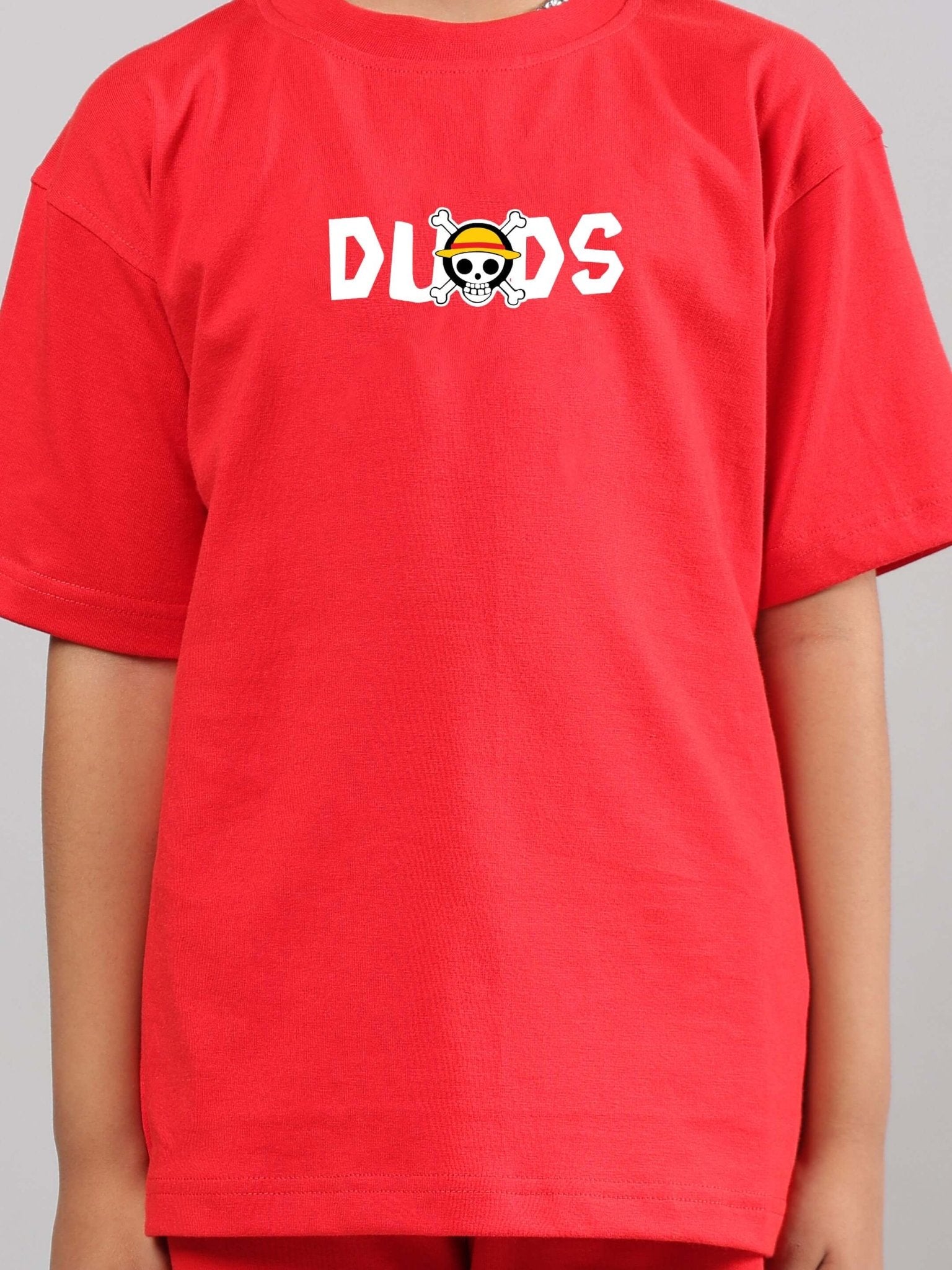 Child wearing One Piece Summer Co-ord for Boys Girls Red with anime-themed design on shirt