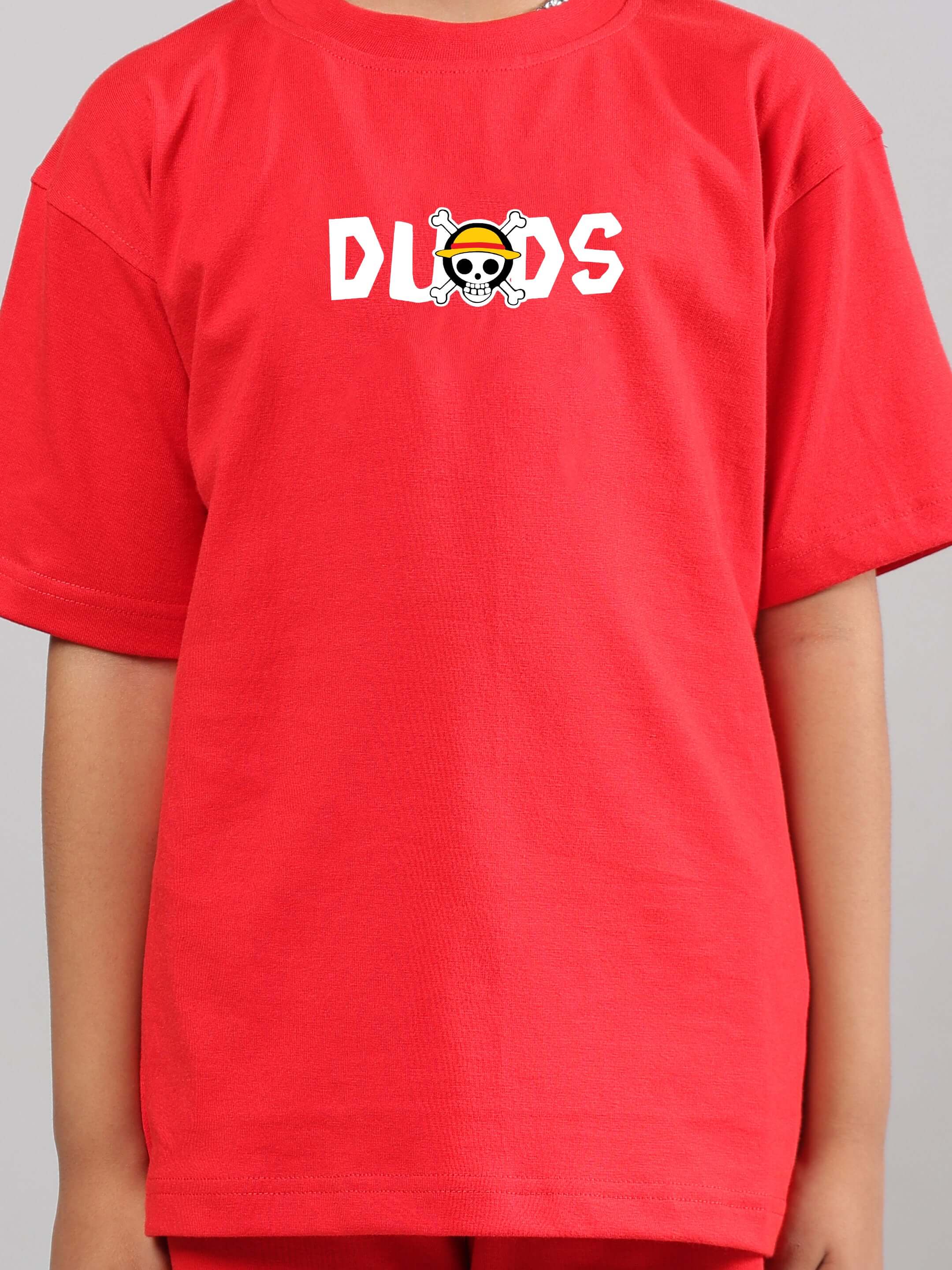 Child wearing red ONE PIECE SUMMER CO-ORD FOR BOYS GIRLS RED t-shirt featuring anime design.