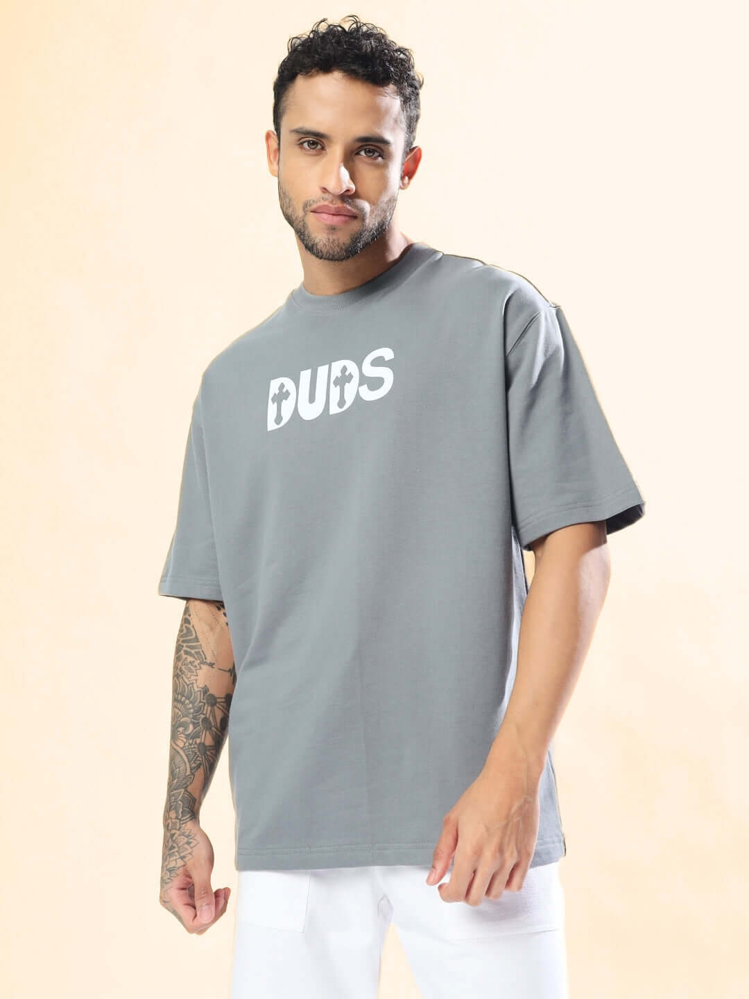 Model wearing grey oversized t-shirt with 'ONLY GOD CAN JUDGE ME' print.