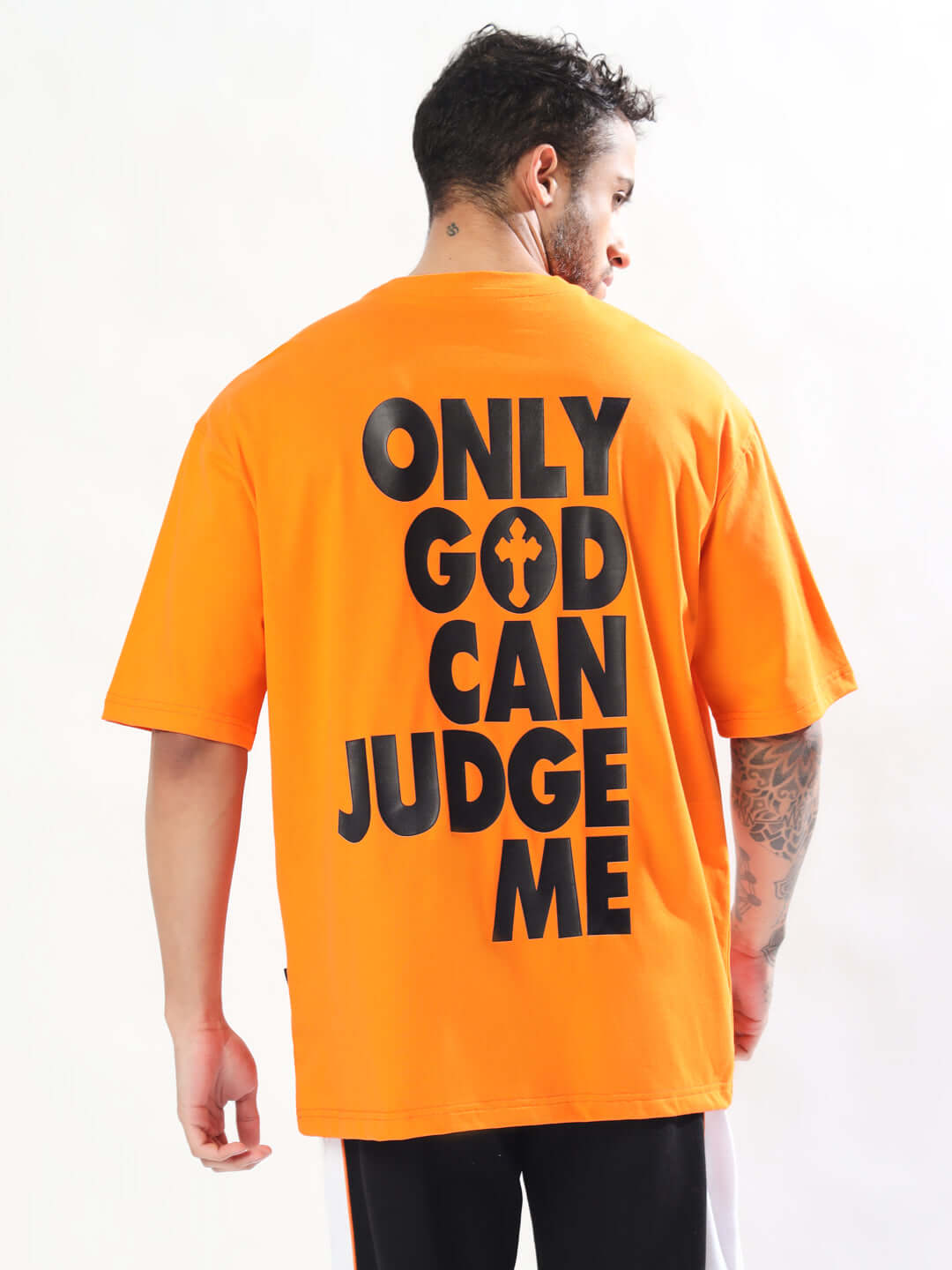 Back view of orange oversized t-shirt with 'ONLY GOD CAN JUDGE ME' text, made of premium cotton and elastane.