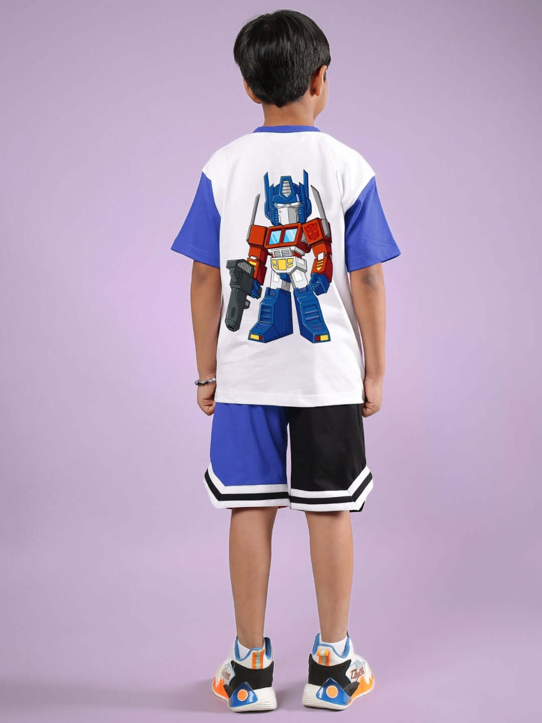 Child wearing Optimus Prime white and blue co-ord set with transformer design, showcasing comfortable and stylish kids' clothing.