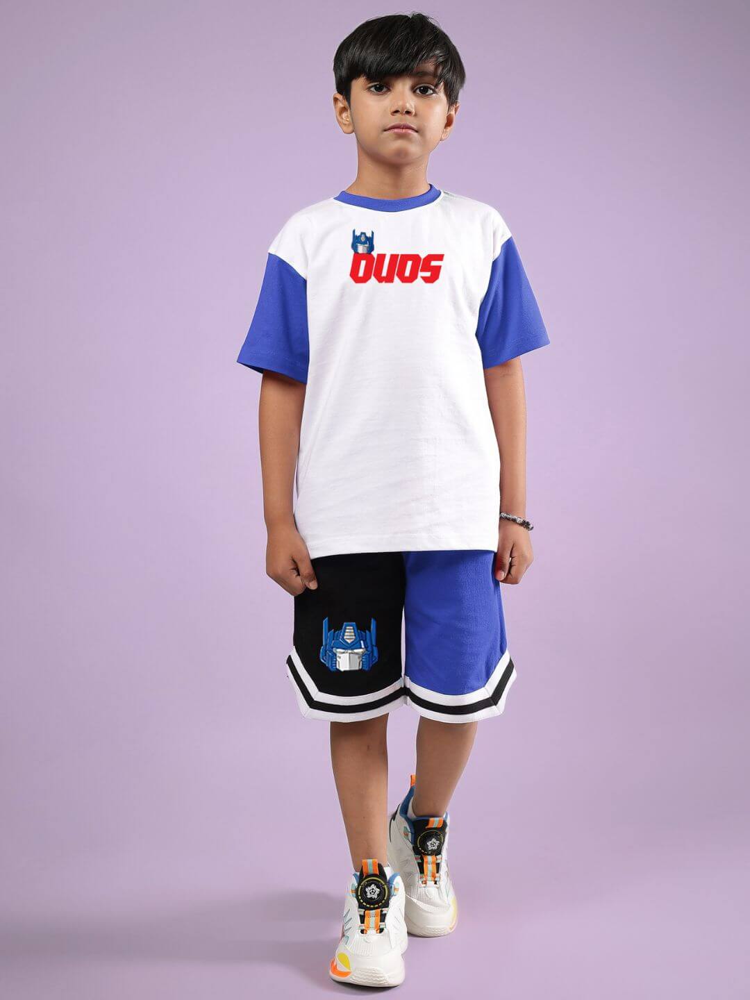 Boy wearing OPTIMUS PRIME CO-ORD FOR BOYS & GIRLS WHITE BLUE, featuring a stylish shirt and shorts combo by DUDS.