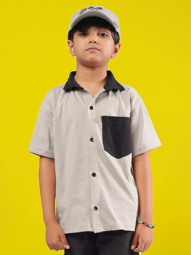 Young child wearing a grey and black Orion shirt, highlighting stylish design and unisex fit, perfect for boys and girls.