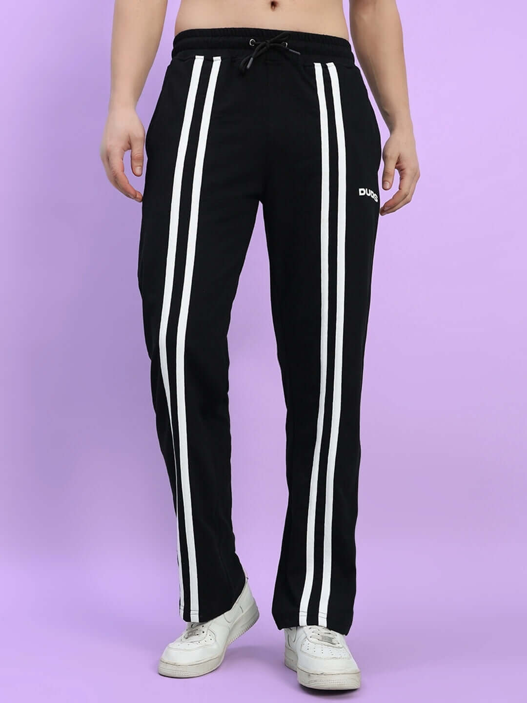 Black Outlook 2 Stripe Jogger with white stripes, made-to-order by DUDS, displayed against a purple background.