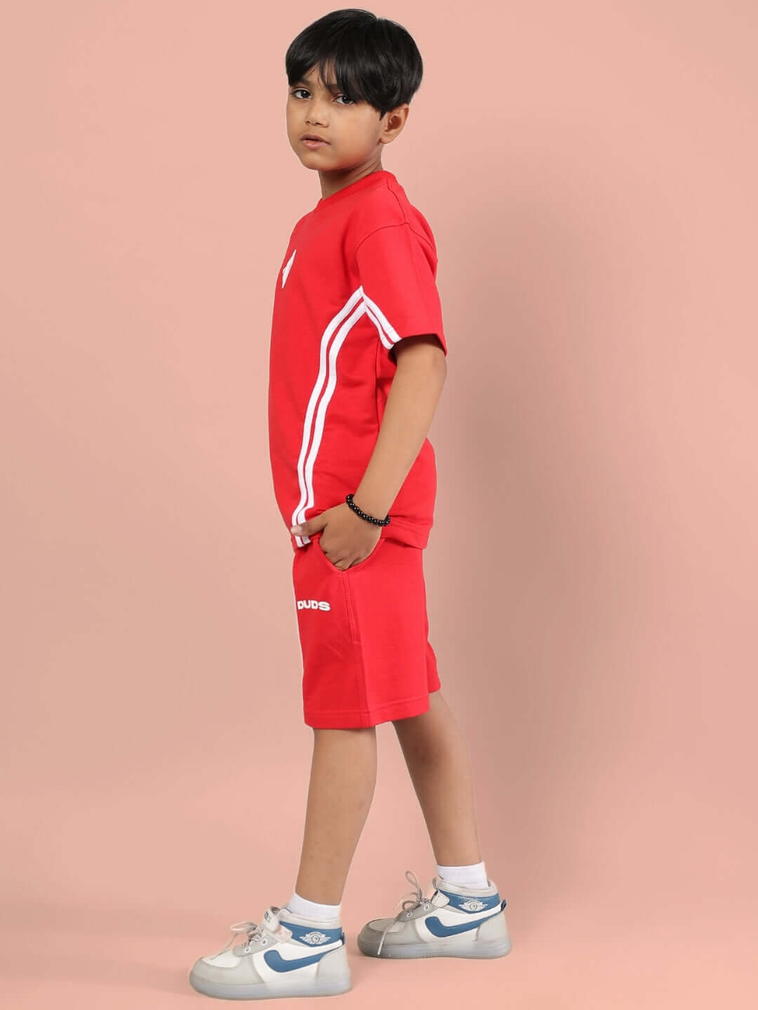 Red unisex co-ord set for kids, featuring tailored shorts and t-shirt, by DUDS.