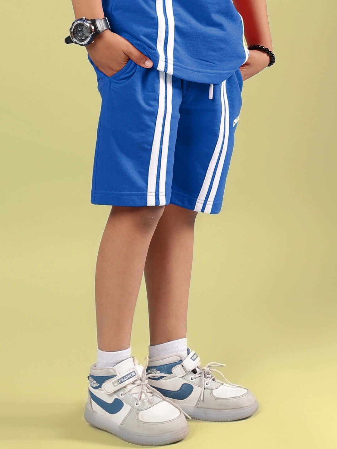 OUTLOOK SHORTS FOR BOYS GIRLS BLUE shown in an active lifestyle setting, perfect for school or play, with breathable fabric and regular fit.