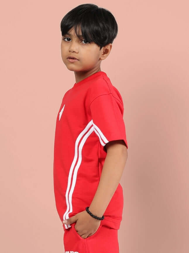 Kid wearing OUTLOOK T-SHIRT FOR BOYS GIRLS RED showing side view with white stripe detail, ideal for everyday style and comfort.