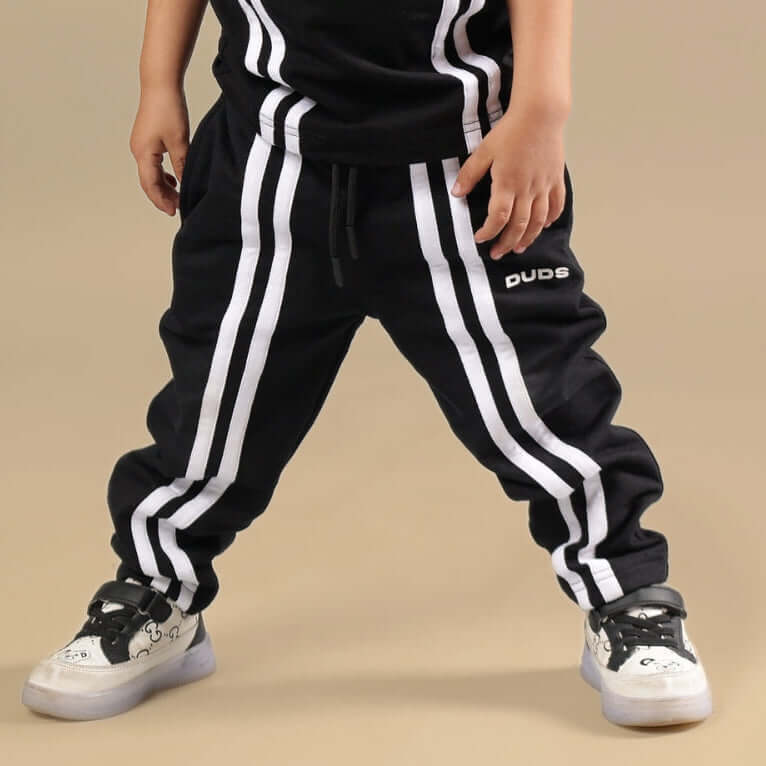 OUTLOOK JOGGER FOR BOYS GIRLS BLACK with stripes, elastic waistband, and cuffed hems, ideal for active days and casual wear.
