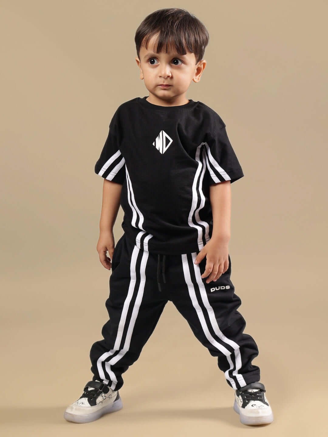 OUTLOOK SUMMER CO-ORD SET FOR BOYS GIRLS BLACK showcasing stylish t-shirt and shorts ensemble in sleek black for cool, modern look.
