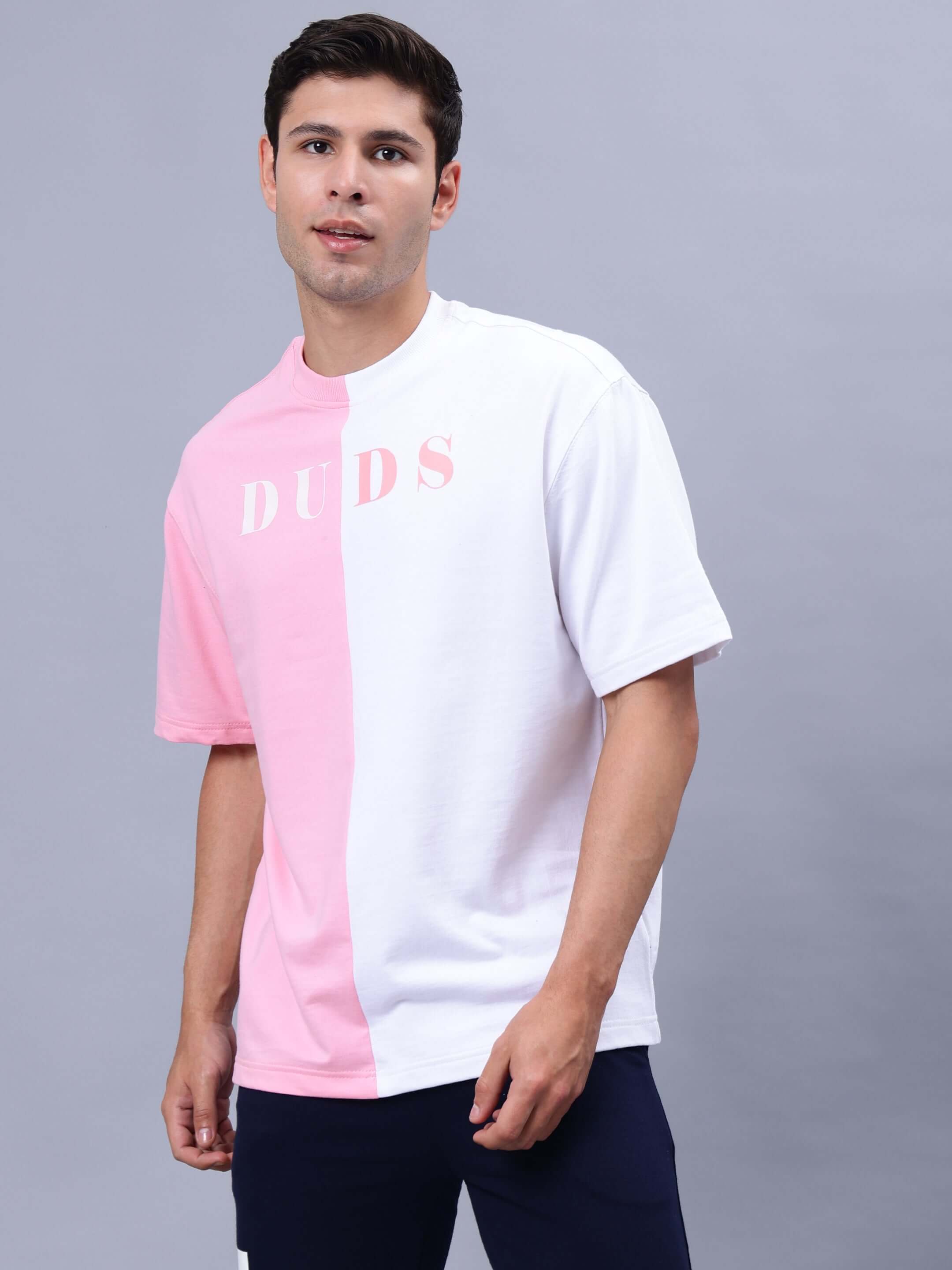 G.O.A.T Oversized T-Shirt in Pink-White, premium heavy gauge fabric, stylish design, worn by a male model.