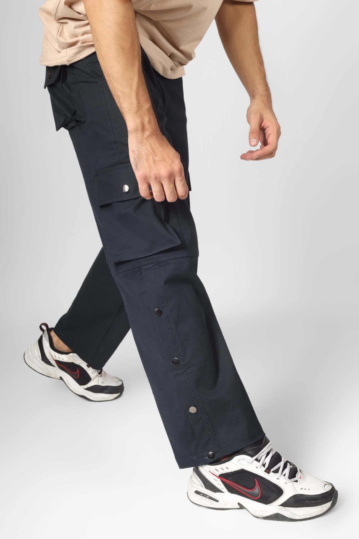 Model wearing OXFORD BLUE CARGO PANTS WITH 6 POCKET, showcasing streetwear style with comfort and versatility.