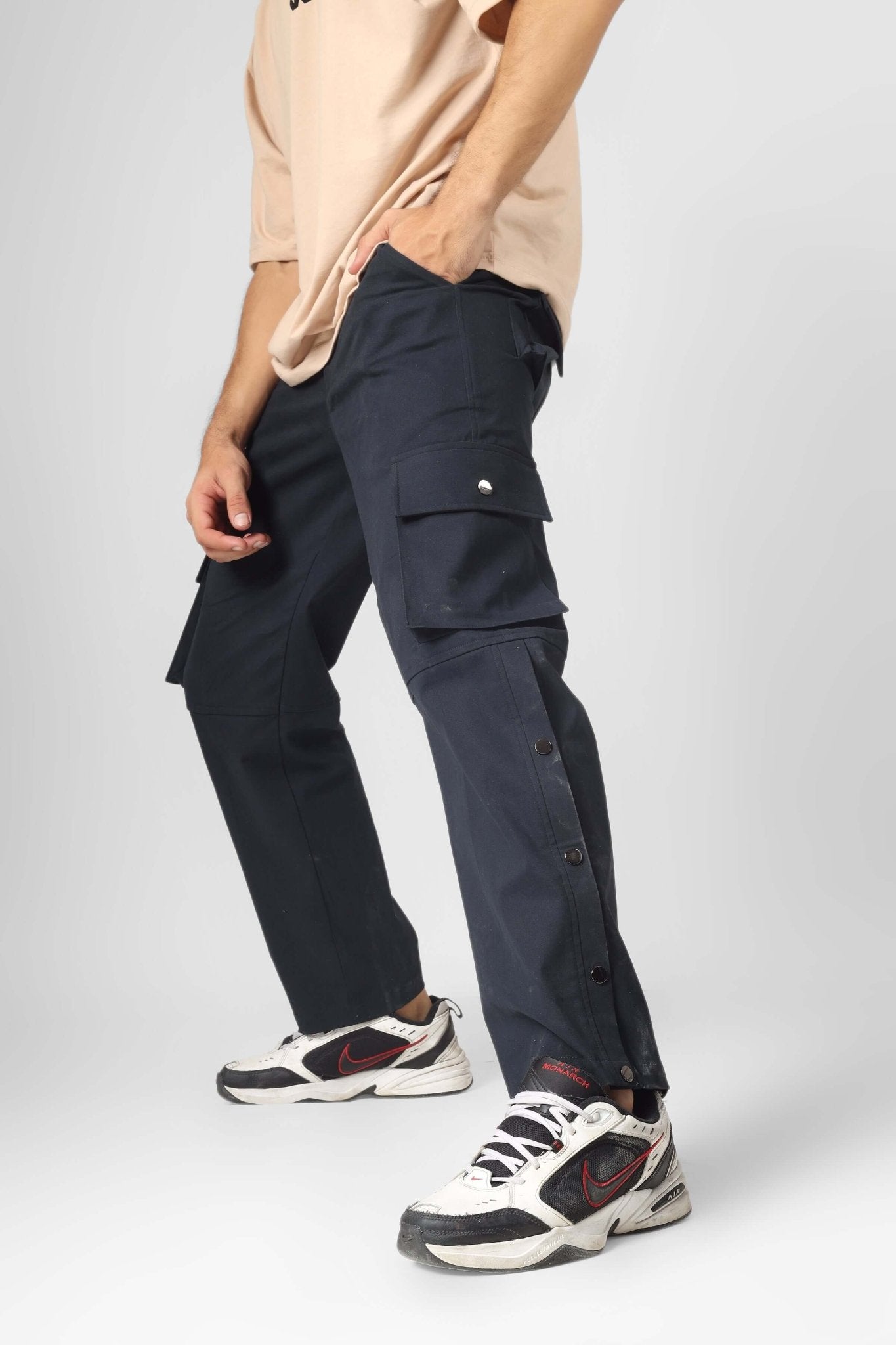 Model wearing OXFORD BLUE CARGO PANTS WITH 6 POCKET, showcasing streetwear style and versatility.