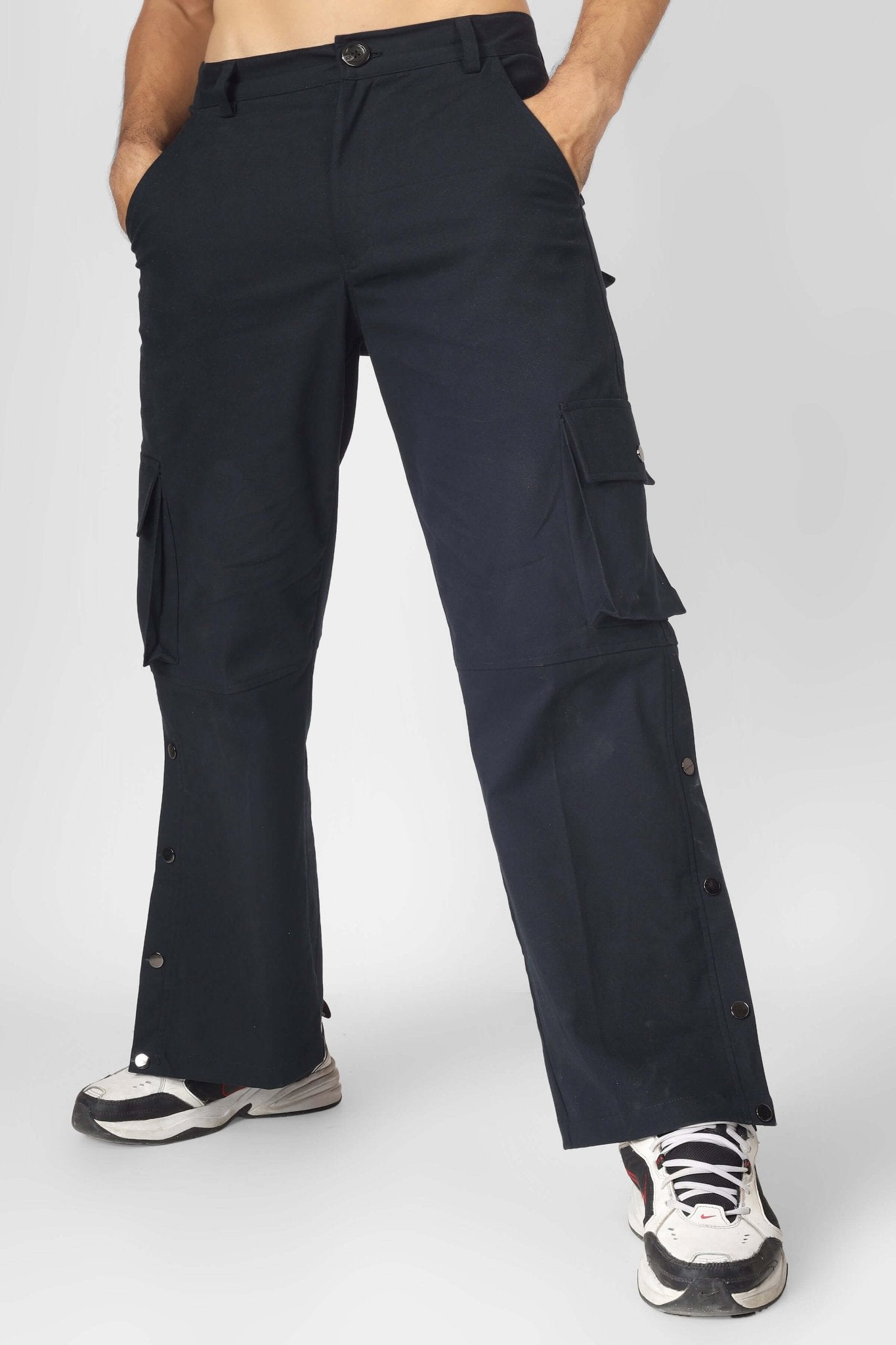 Model wearing OXFORD BLUE CARGO PANTS WITH 6 POCKET showcasing versatile streetwear style in rich blue tone.