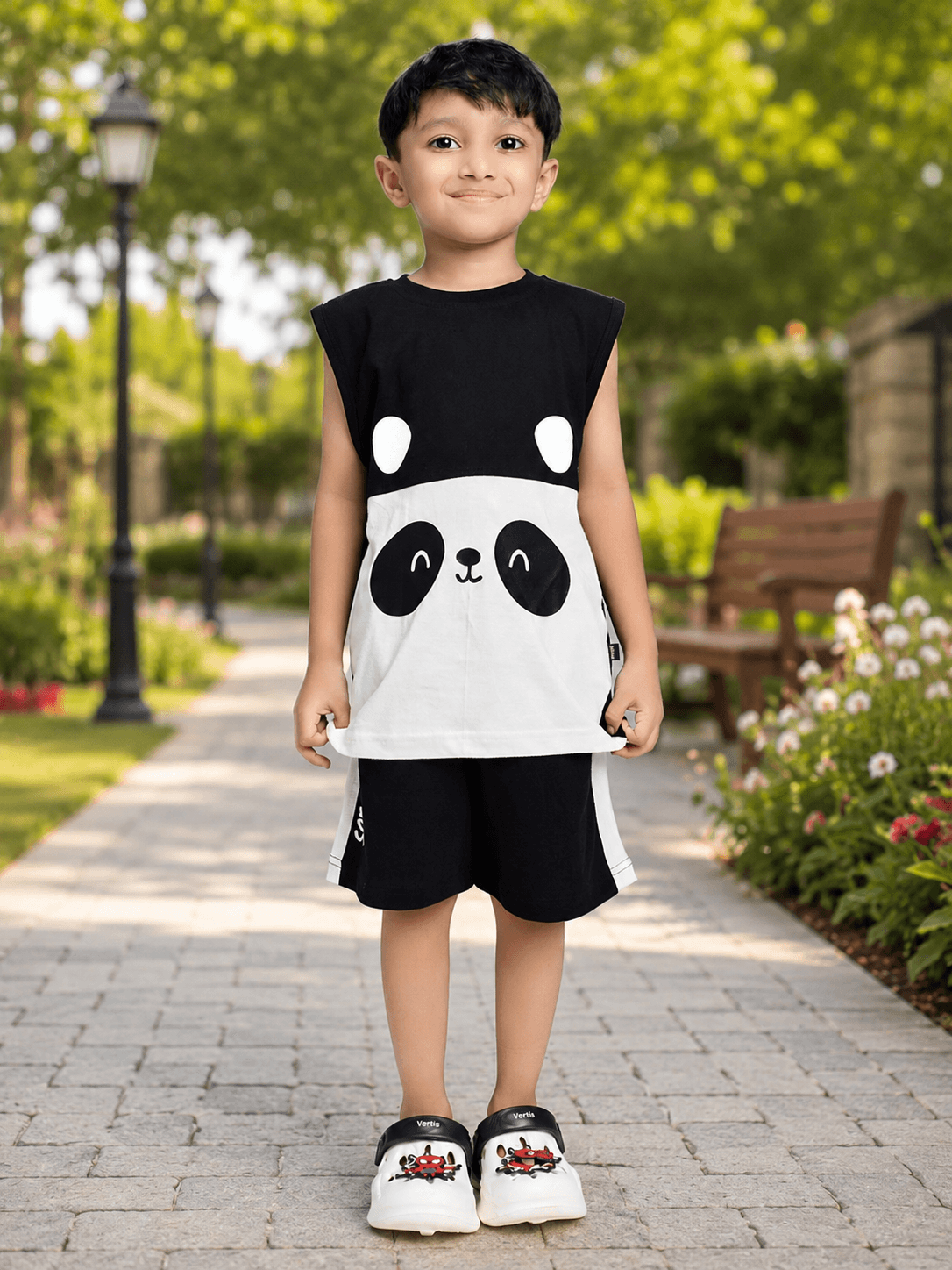PANDA POP SLEEVELESS CO-ORD FOR BOYS GIRLS BLACK WHITE, featuring a child wearing a panda-themed sleeveless top and shorts.