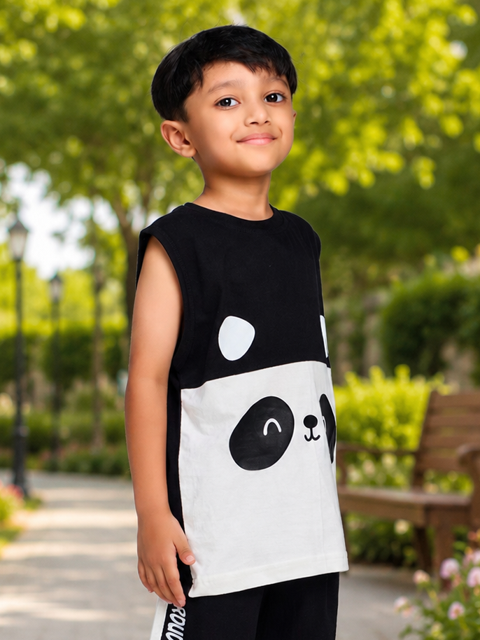 PANDA POP SLEEVELESS T-SHIRT FOR BOYS GIRLS BLACK WHITE worn by a smiling boy in a park.