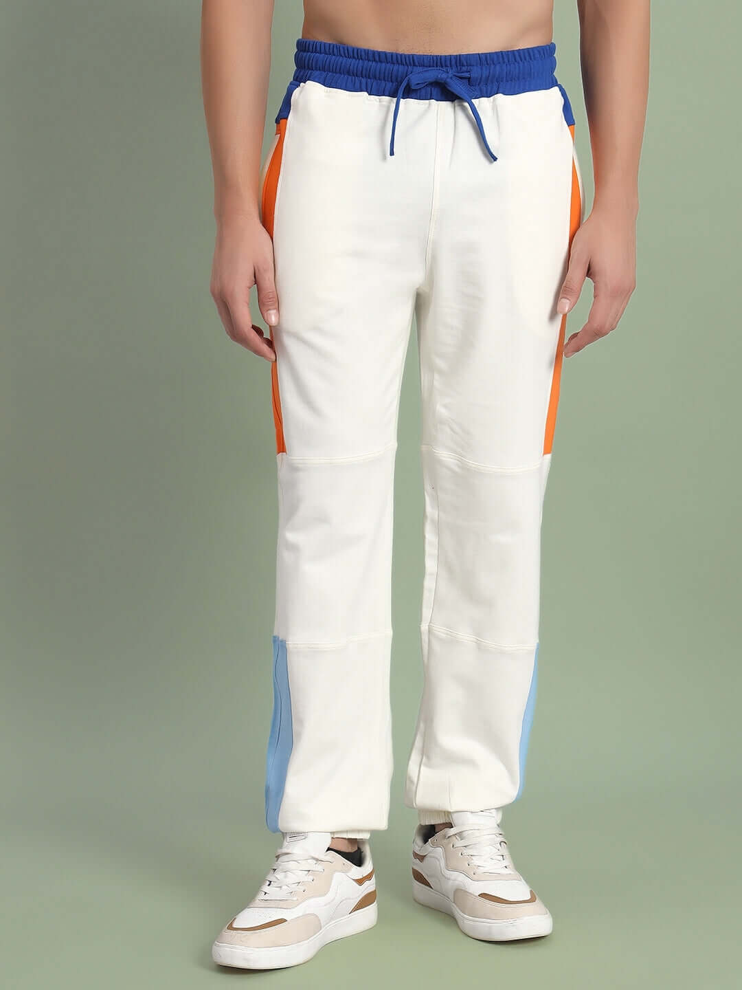 Off-white PARKER Side Contrast Joggers with blue and orange accents, made-to-order by DUDS, shown with white sneakers.