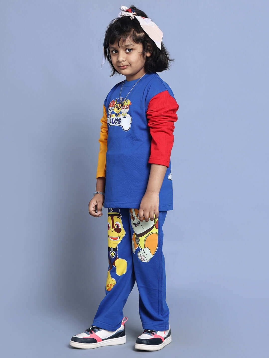 Child wearing Paw Patrol oversized blue co-ord set for boys and girls, featuring colorful joggers with elastic waistband and character design.