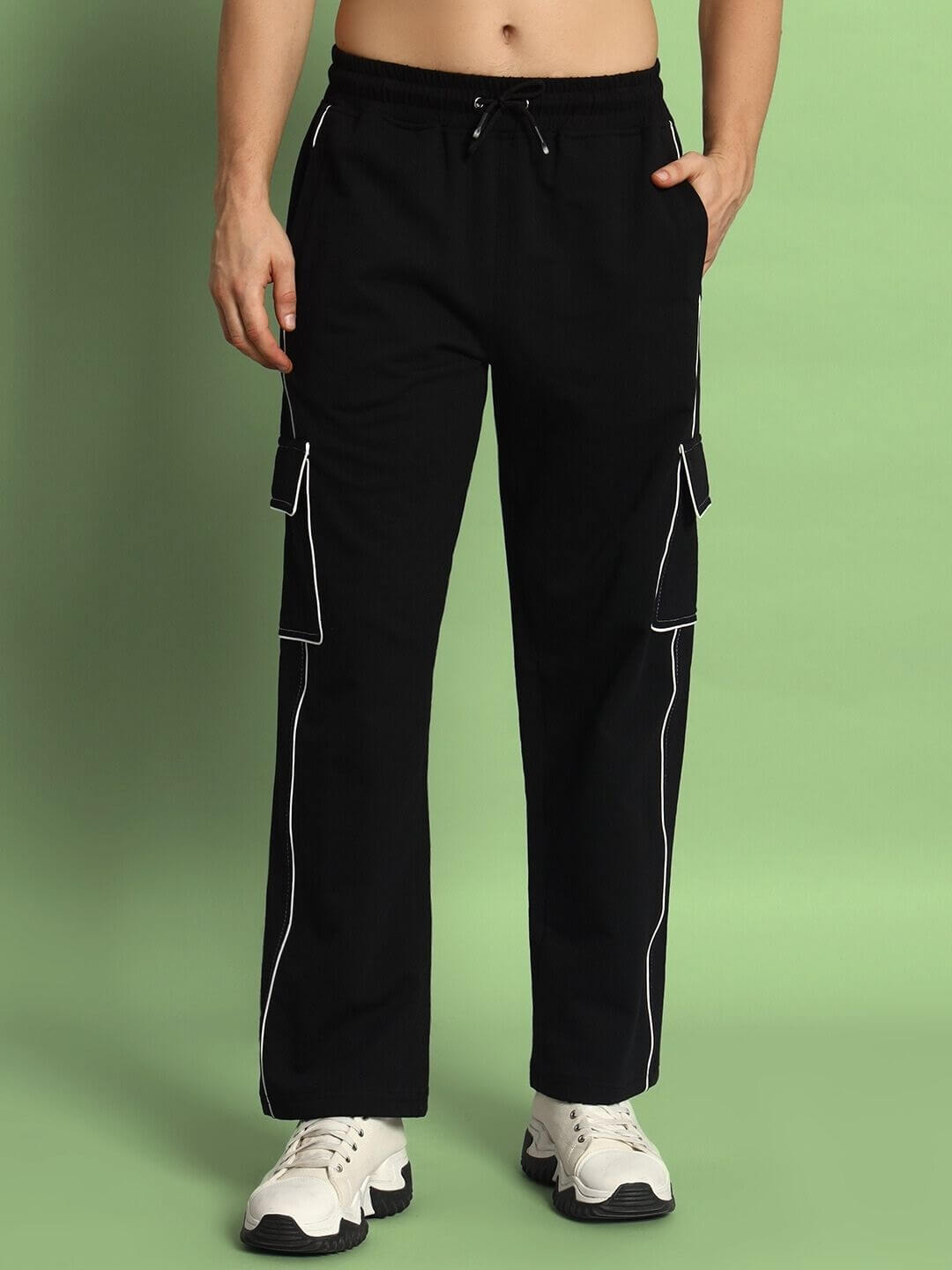 Model wearing black pedal contrast stitch cargo pants with white stitching from DUDS, featuring side pockets.