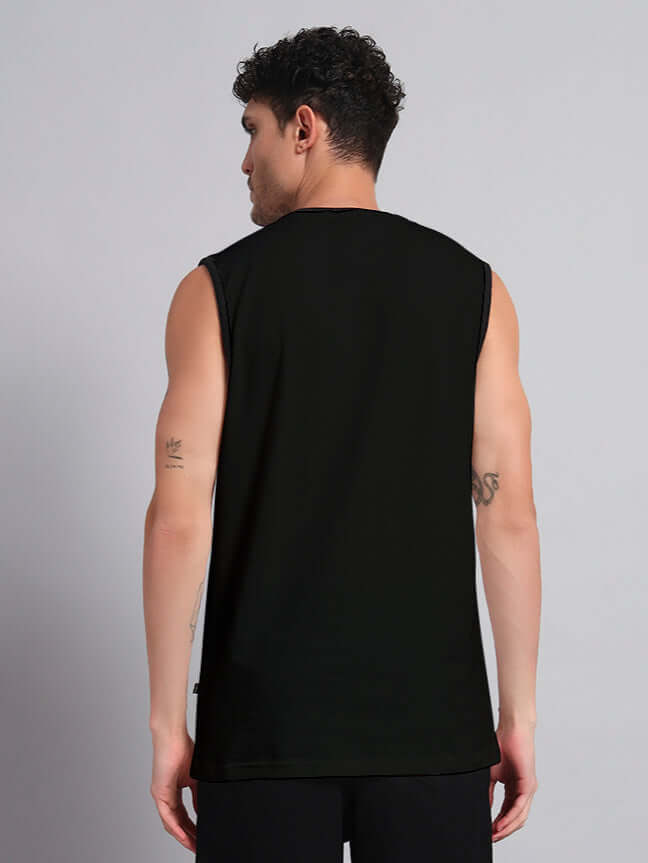 Back view of model wearing a sleeveless black t-shirt showcasing casual summer style.
