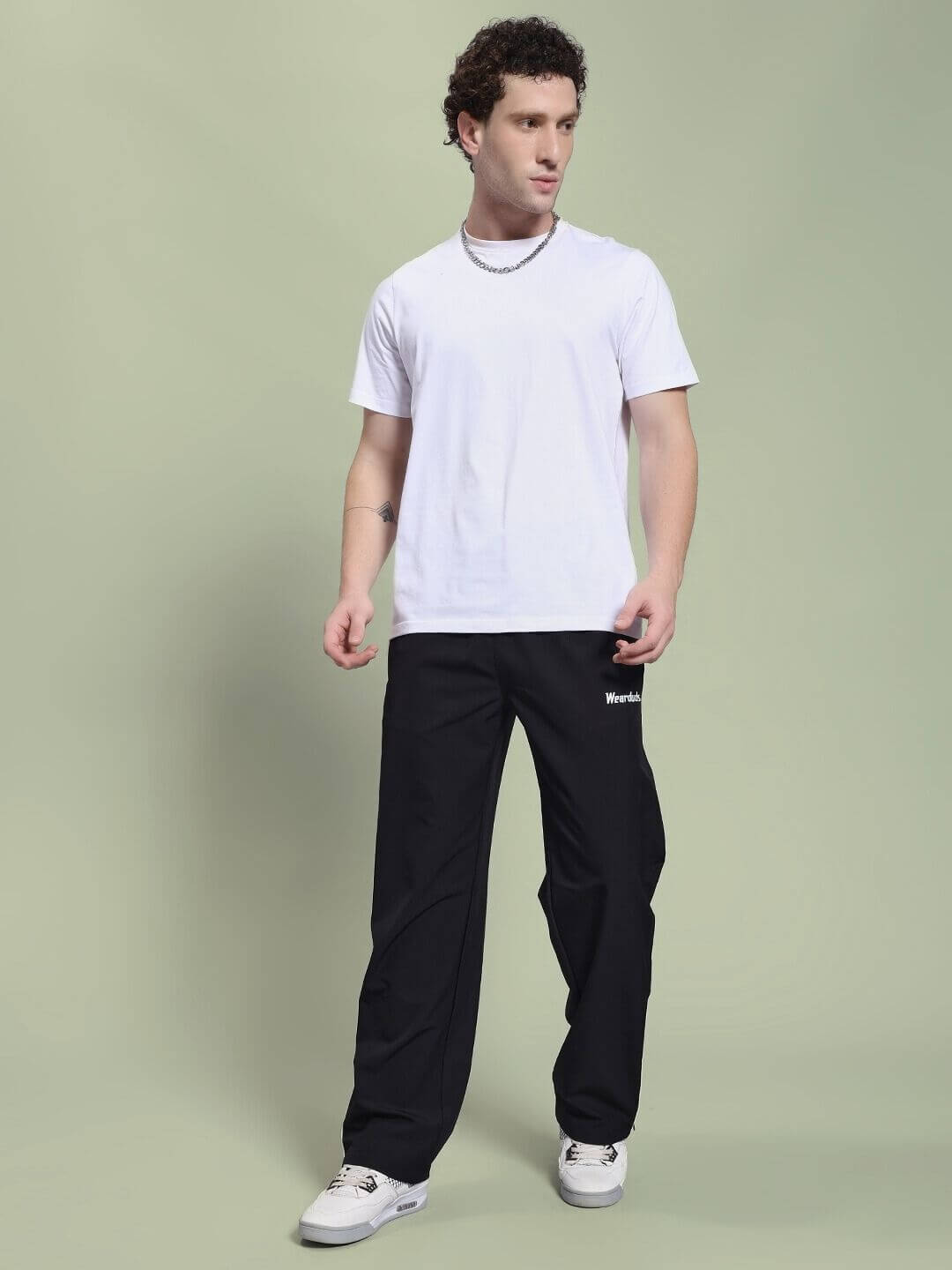 Man wearing PERFACT RELAXED-FIT JOGGER BLACK in a casual outfit, perfect for comfort and style.