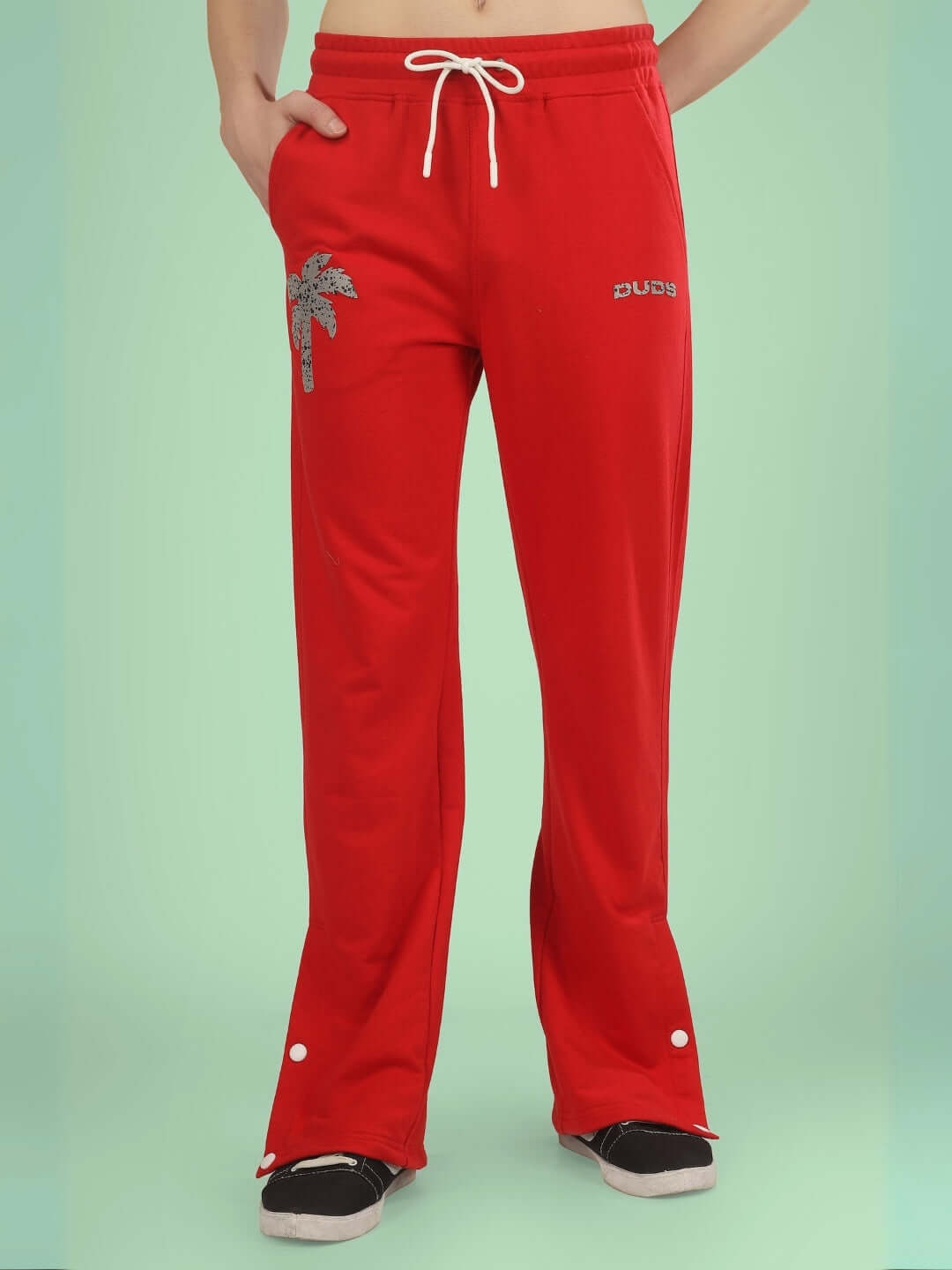 Phoenix digital printed red joggers by DUDS featuring palm tree design and custom fit option.