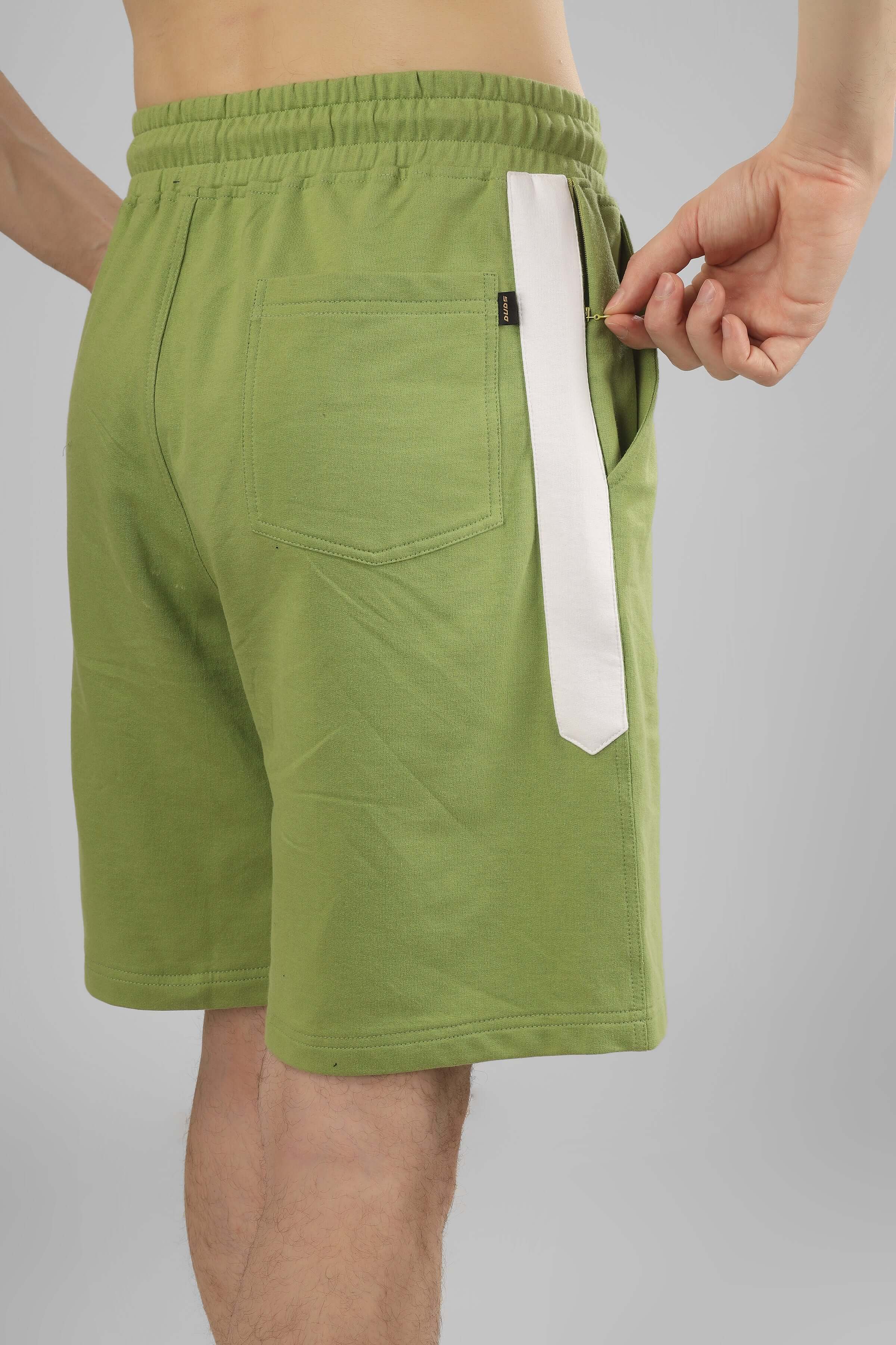 Model wearing pista green Glazy Co-ord shorts with side pocket, showcasing premium cotton fabric and comfort fit. Made in India.