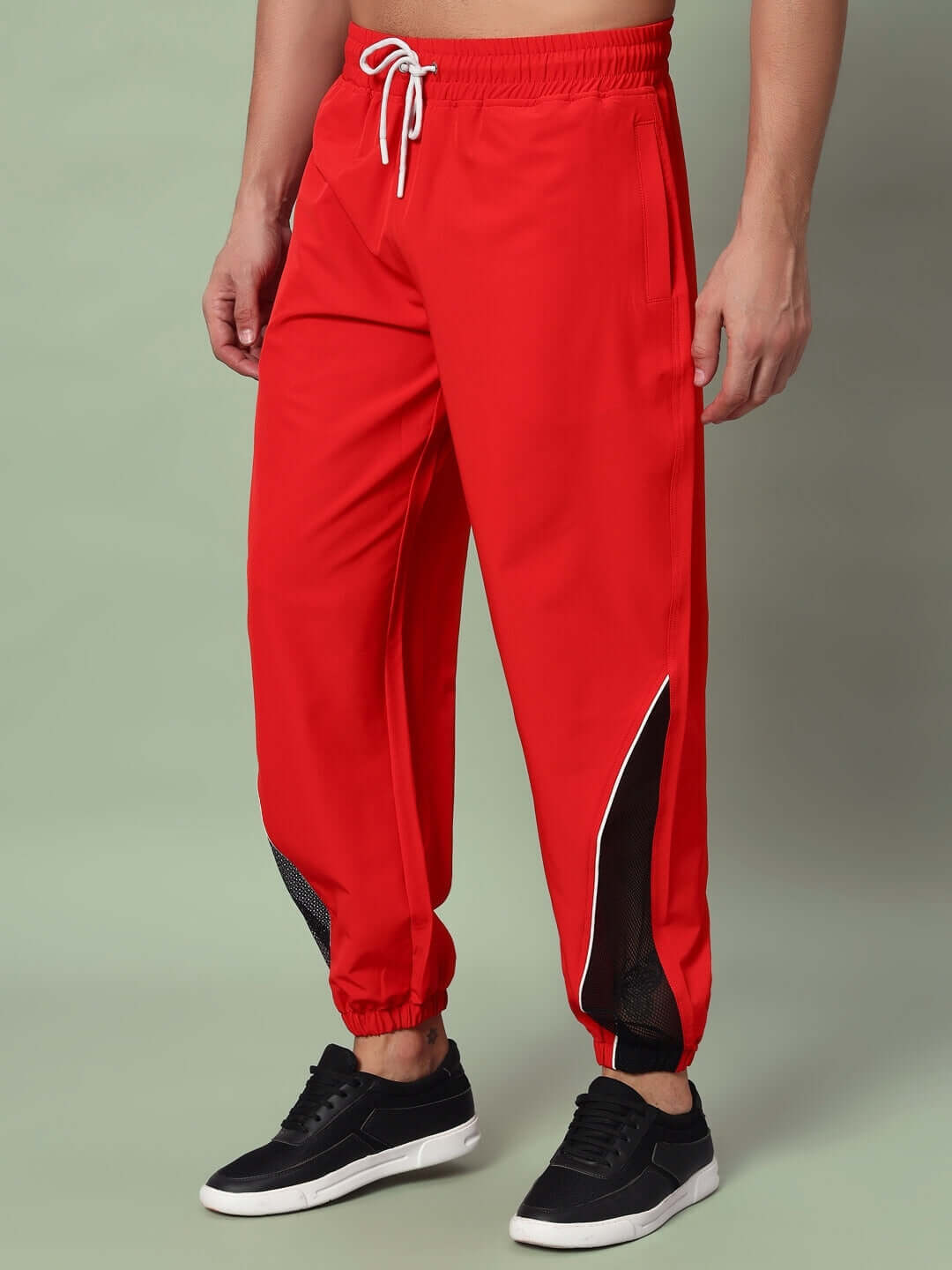 Red PLEXUS joggers with customizable fit options by DUDS, made to order by experienced tailors.