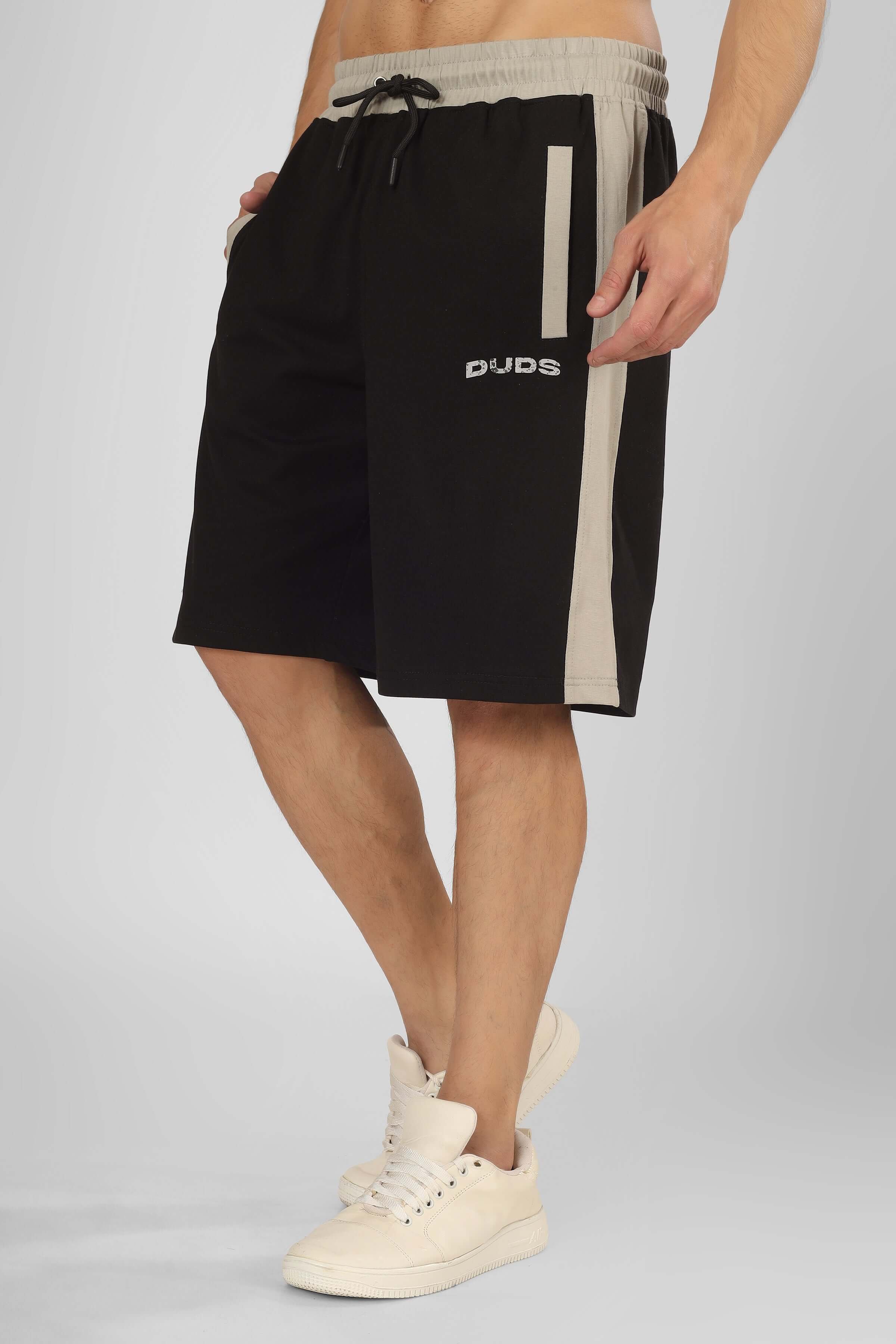 Stylish black Pluto Contrast regular fit shorts with customizable size option, shown on model wearing white sneakers.