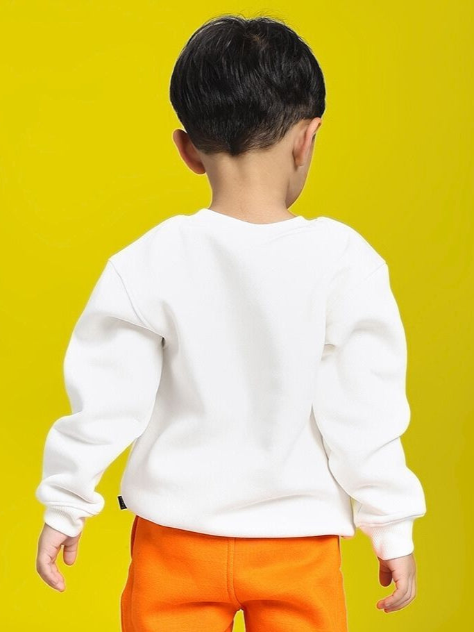 Boy wearing POKEMON TOON FLEECE SWEATSHIRT FOR BOYS AND GIRLS OFF-WHITE with orange pants on a yellow background.