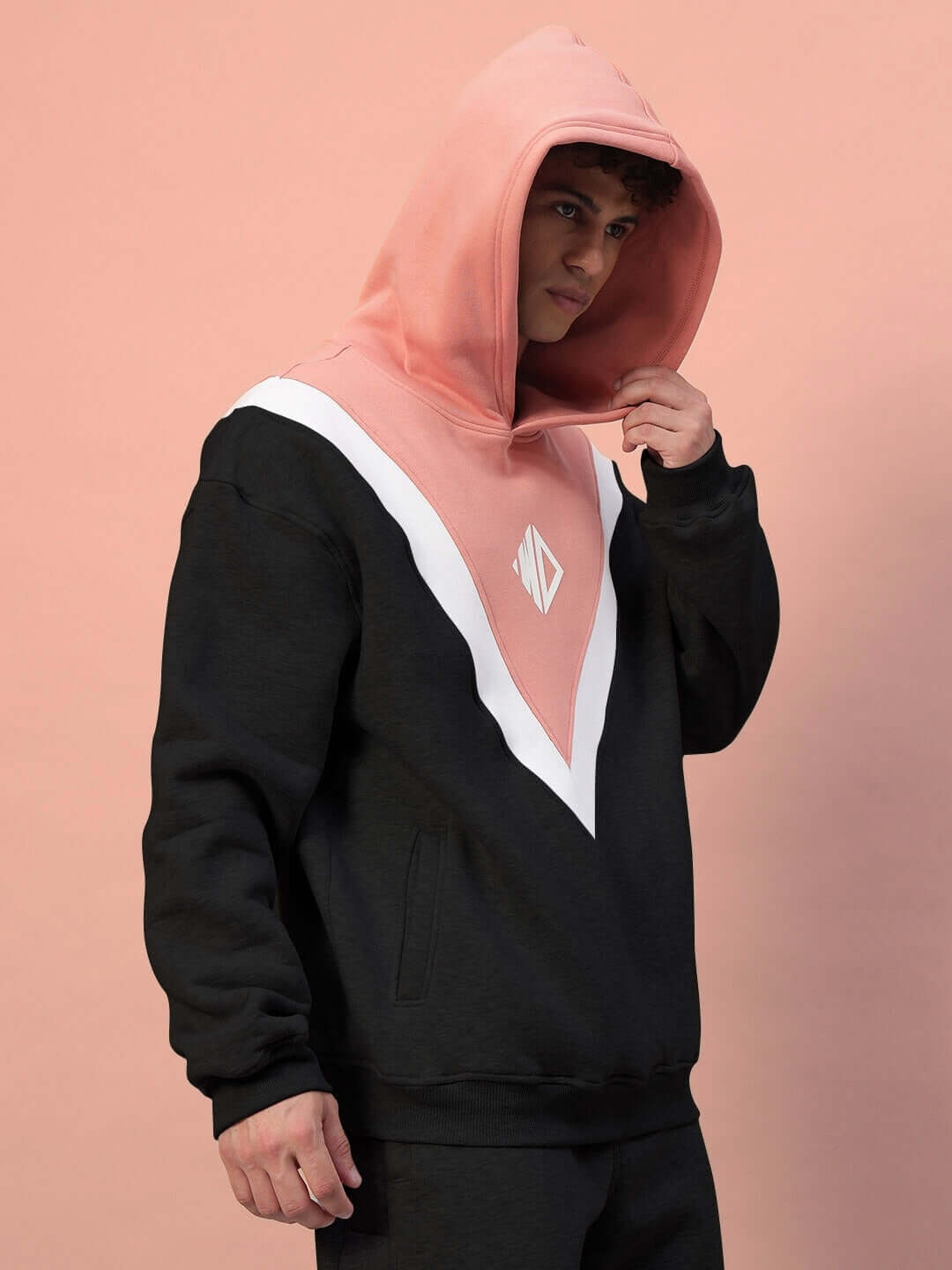 Model wearing POLAR COLORBLOCK CO-ORD BLACK PEACH hoodie featuring black and peach design with premium fleece for a cozy, stylish look.