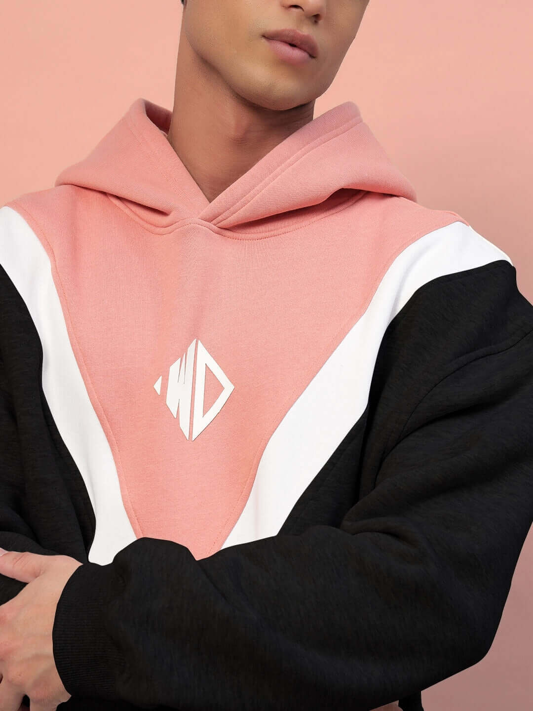 Model wearing POLAR COLORBLOCK HOODIE BLACK PEACH with black and peach design, showcasing streetwear style and cozy comfort.