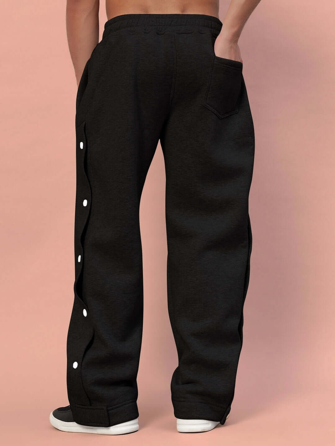 Back view of Polar Cotton Fleece Jogger in black, showcasing side buttons and a pocket. Made of premium cotton fleece for warmth and style.