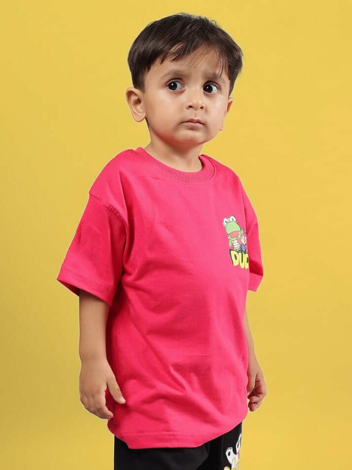 Boy wearing PORORO OVERSIZED T-SHIRT FOR BOYS GIRLS PINK standing against a yellow background.
