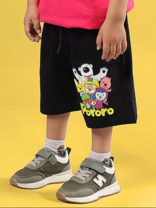 Child wearing black Pororo shorts showing cartoon characters, suitable for boys and girls. Made to order by DUDS Tailors.