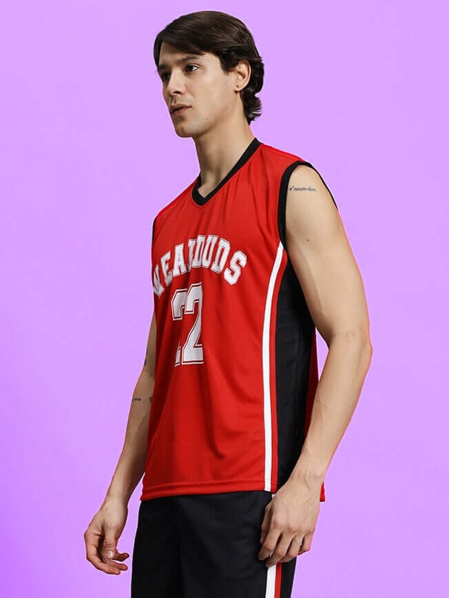 Man wearing PORTIA GYM SLEEVELESS T-SHIRT RED on purple background