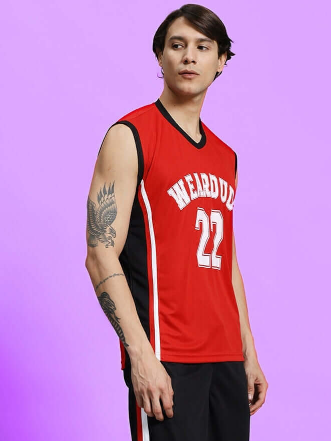 Man wearing PORTIA GYM SLEEVELESS T-SHIRT RED with tattoo, athletic look.