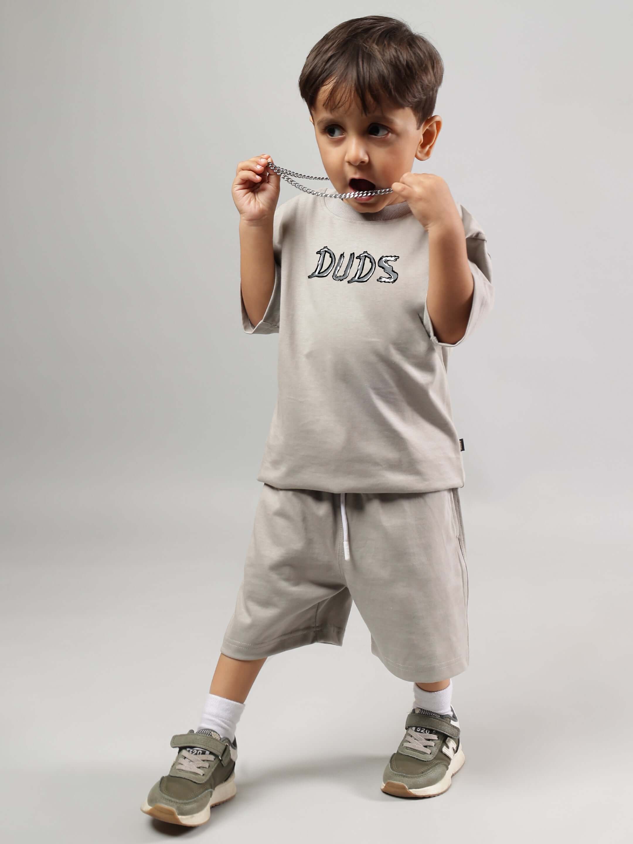 Young child wearing POSITIVE RABBIT KIDS CO-ORD FOR BOYS GIRLS GREY outfit, stylish and comfy for play. Cotton-blend fabric.