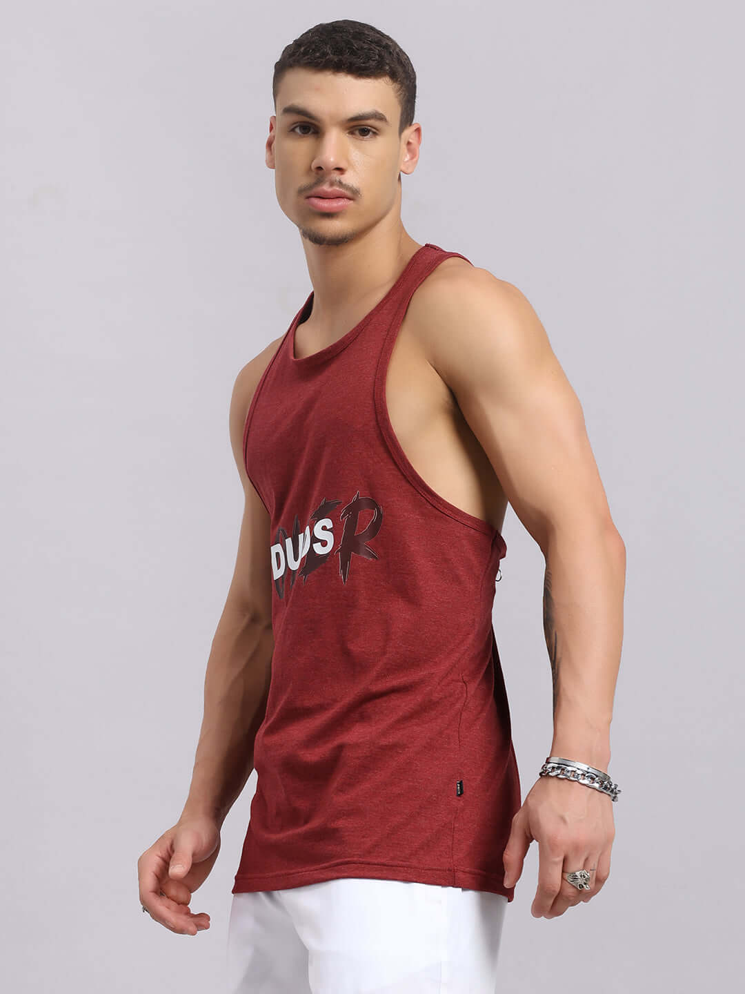 Model wearing maroon Potential Printed Gym T-Shirt with DUDS logo, showcasing athletic fit. Available in Custom Fit option for prepaid orders.