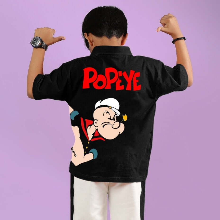 Child wearing a black Power Kids shirt with Popeye design on the back, showcasing strong and playful style for boys and girls.