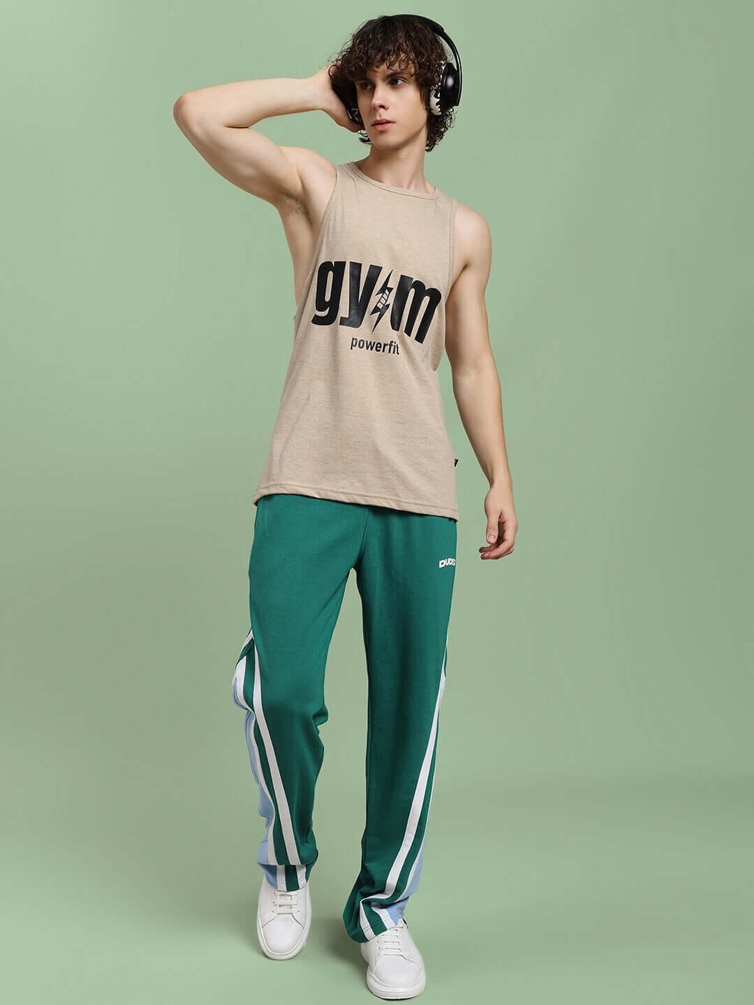 Model wearing beige PowerFit fitness gym t-shirt with custom fit option, perfect for workouts. Available for prepaid orders. Handmade quality.