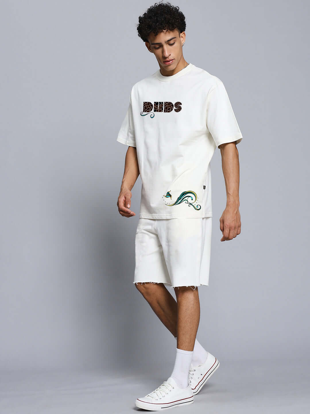 Alt Tag: Model wearing PREMIUM FISH PRINT CO-ORD SET OFF WHITE showcasing trendy and comfortable kids' outfit with playful design.