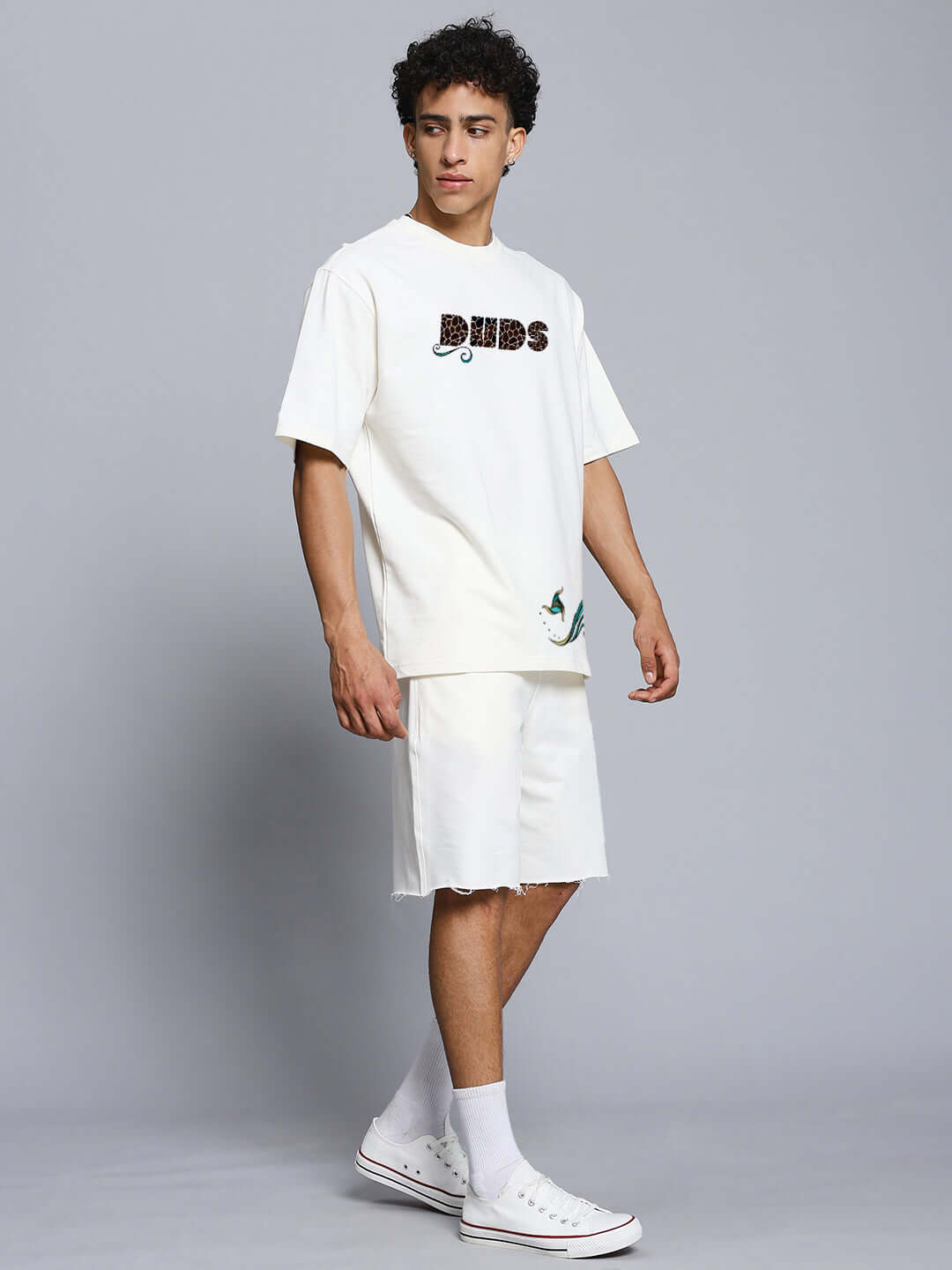 PREMIUM FISH PRINT CO-ORD SET OFF WHITE modeled on male; trendy cotton-blend outfit for kids.