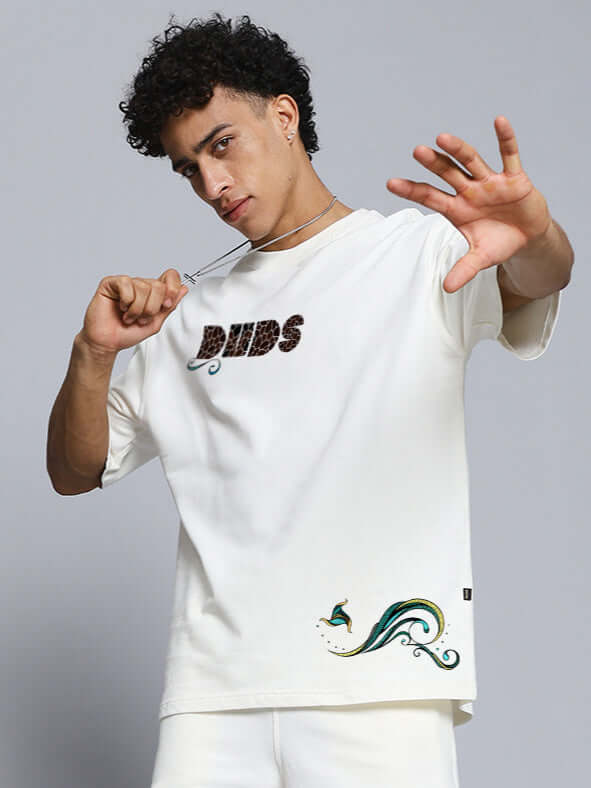 Model wearing Premium Fish Print Over-sized T-shirt in Off White made from cotton French terry with unique design, by Color By Colours.