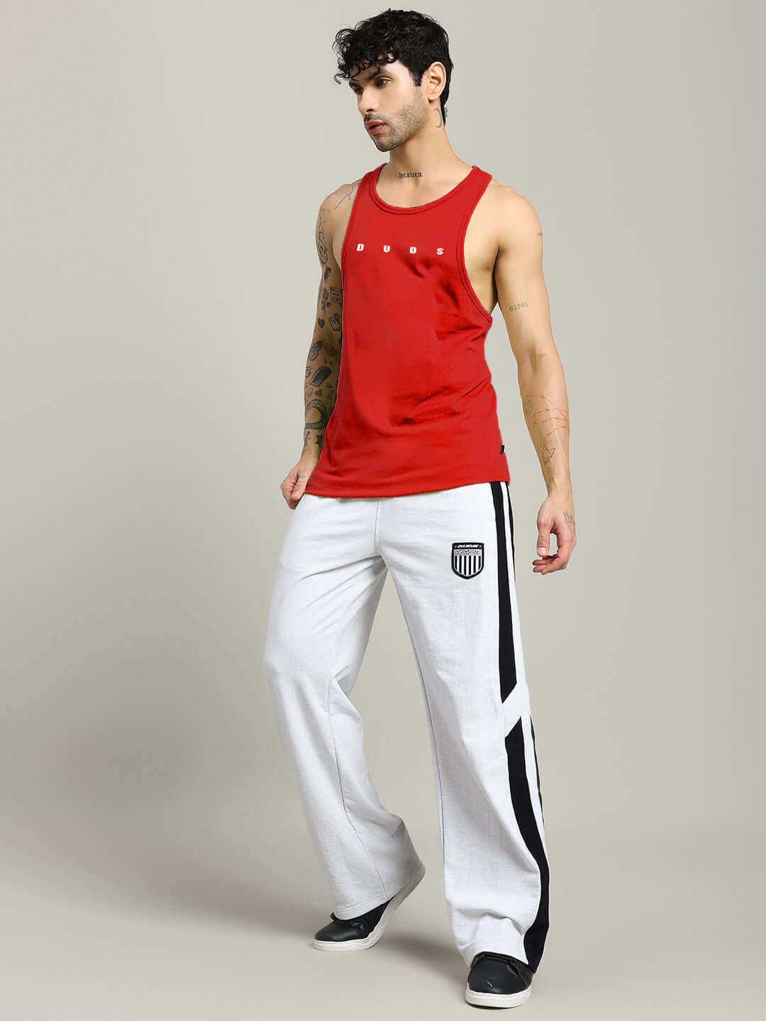 Model wearing Primo Gym T-Shirt Red Premium Workout Tee, showing athletic fit and breathable fabric in fitness setting.