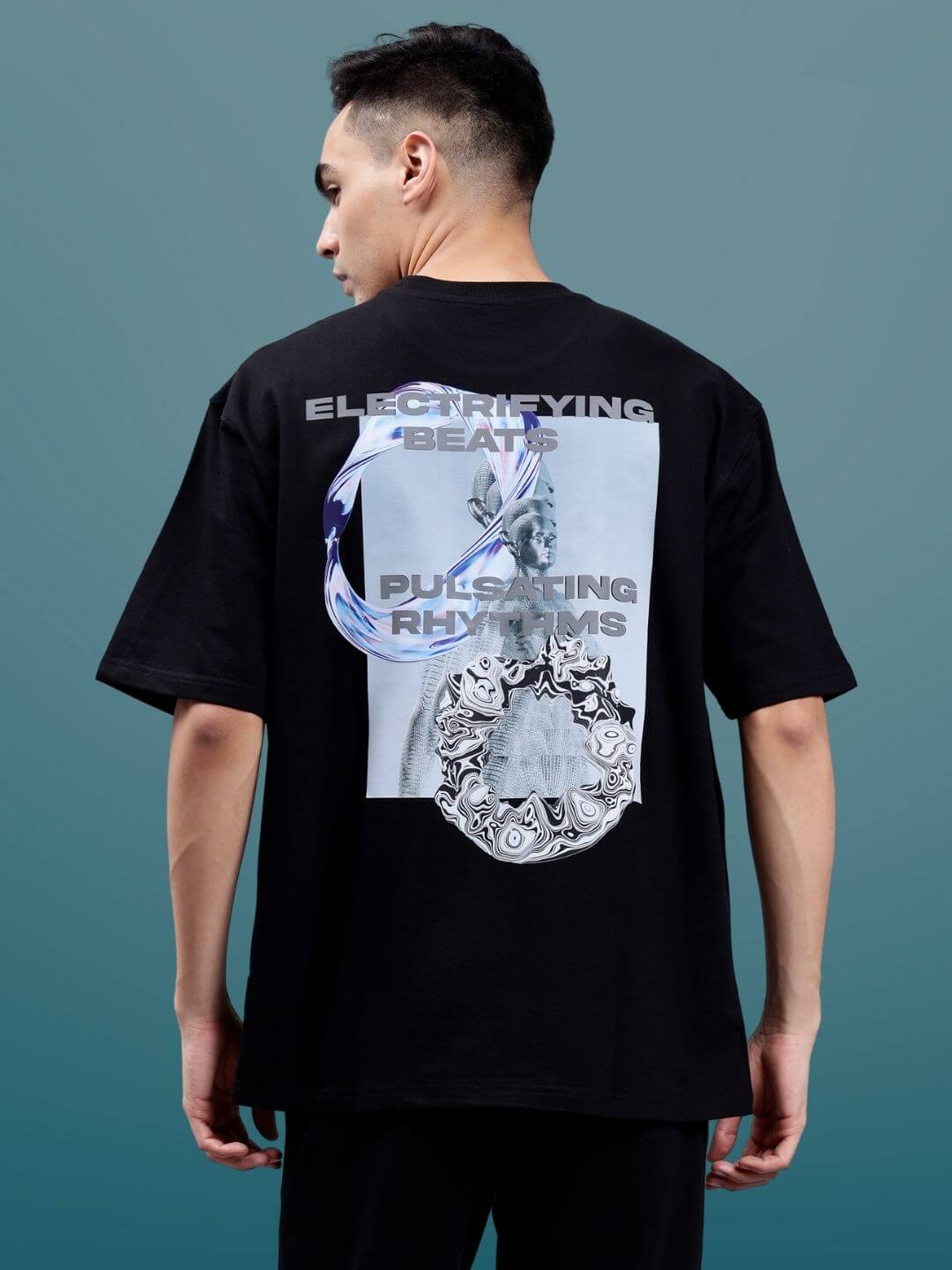 Back view of the Pulsating Rhythms over-sized black T-shirt, featuring unique graphics and text print.