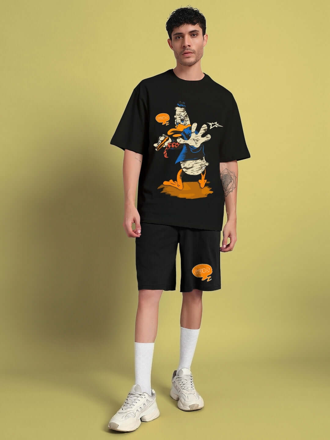 Model wearing QUACK OFF CO-ORD SET in black, featuring premium cotton fabric and bold graphic design, styled for a contemporary look.
