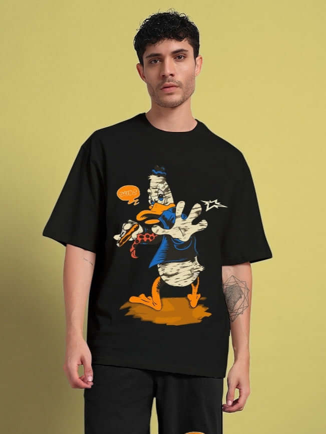 Man wearing a black "Quack Off" oversized t-shirt with a cartoon duck print, perfect for trendy and comfortable summer style.