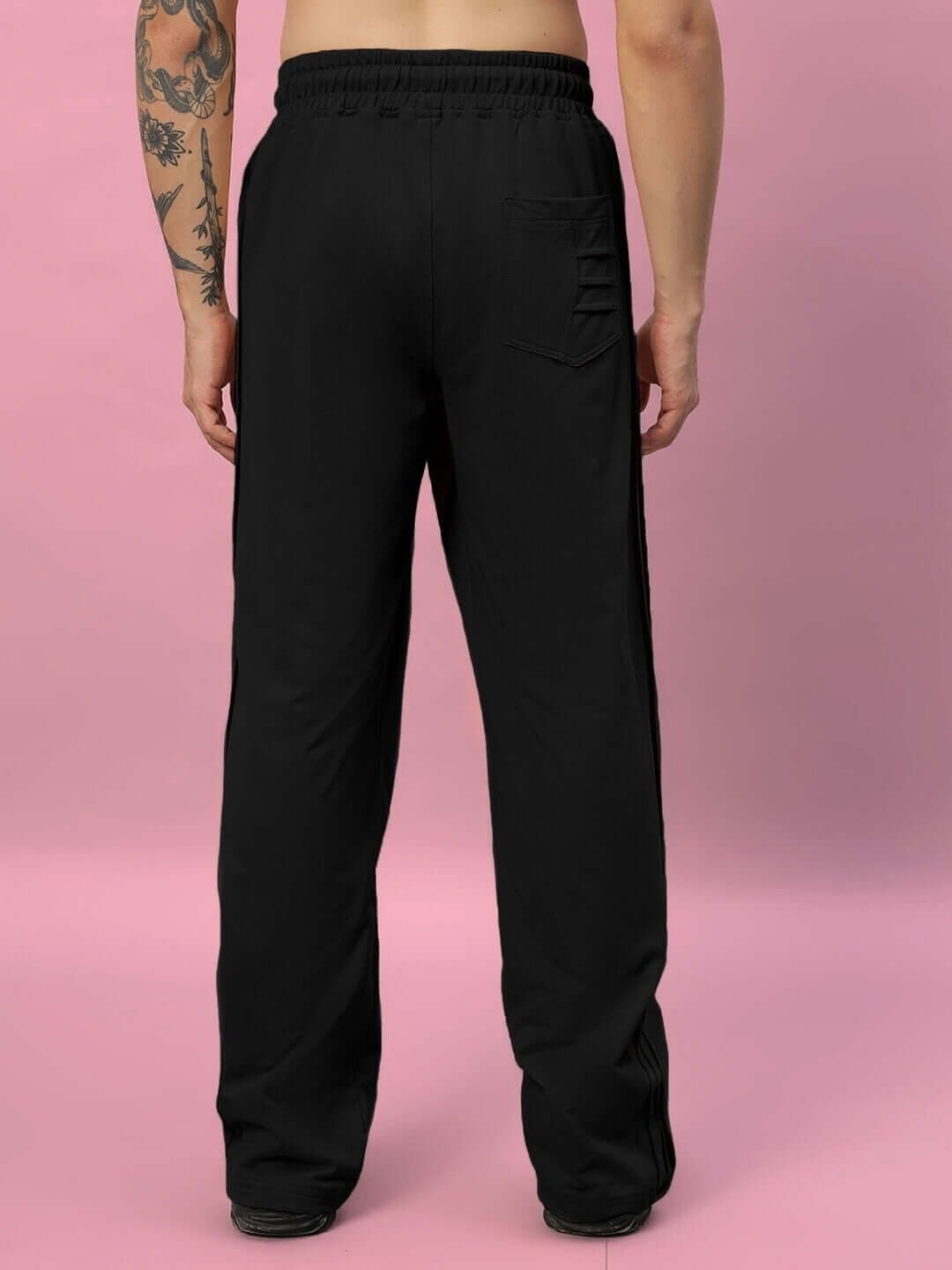 Back view of a person wearing black Quantum Relaxed-Fit Joggers, showcasing the comfortable fit and casual style.