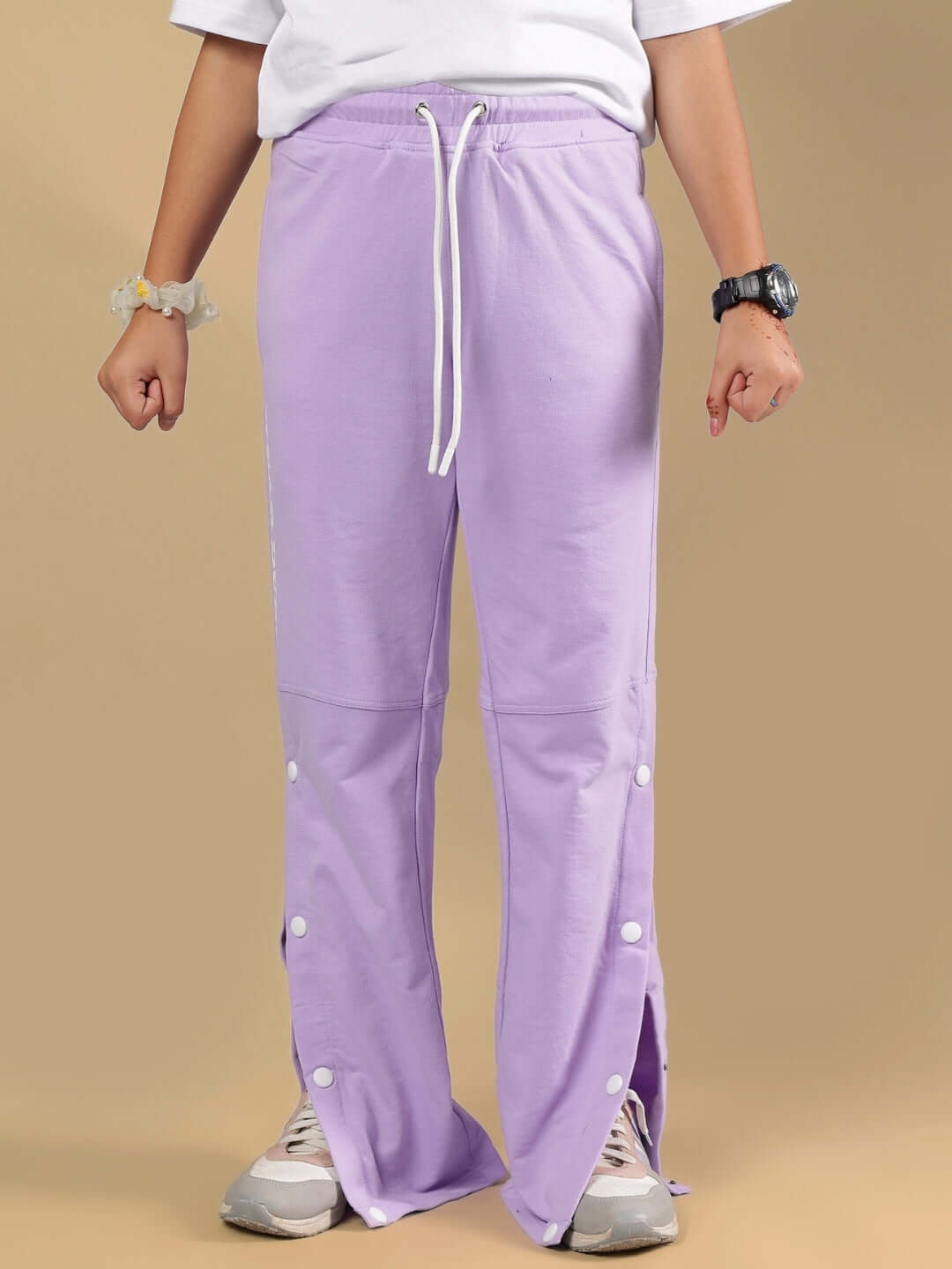 Child wearing RACER JOGGER FOR BOYS & GIRLS LAVENDER showing buttons and drawstring details.