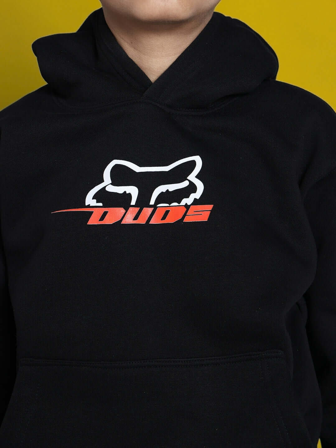 Child wearing Racing Fox oversized black hoodie with bold logo design, suitable for boys and girls. Perfect for casual and sportswear.
